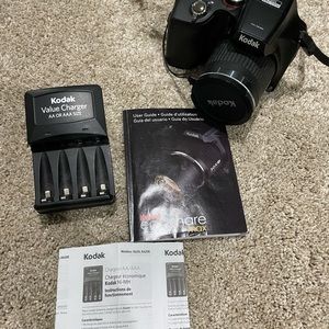 Black Kodak camera with accessories